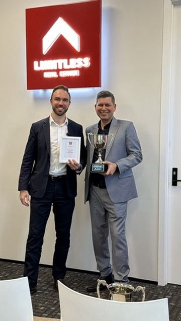 Lawrence with his top performing agent trophy